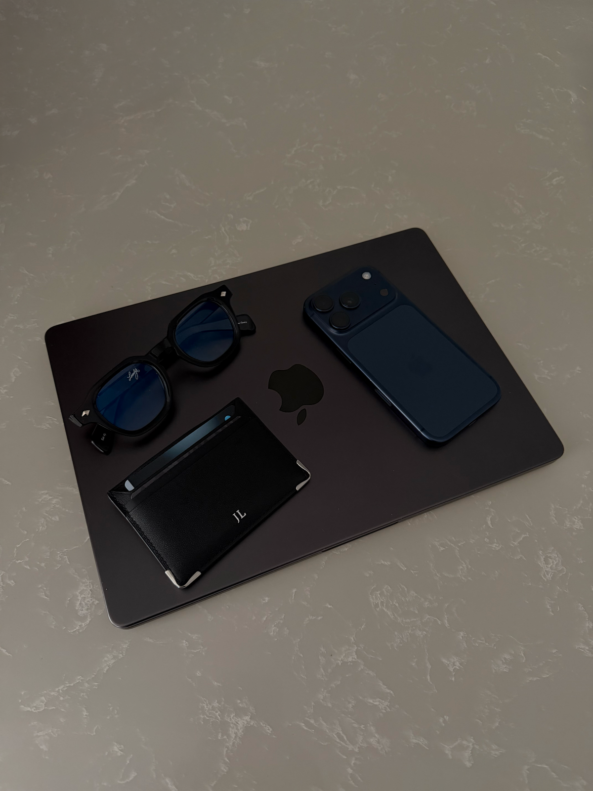 Loculia Noir flatlay with essentials