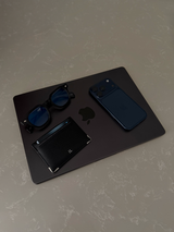 Loculia Noir flatlay with essentials